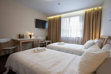 Фото номера Двухместный номер с 2 отдельными кроватями Отель Porins Hotel г. Лиепая 3