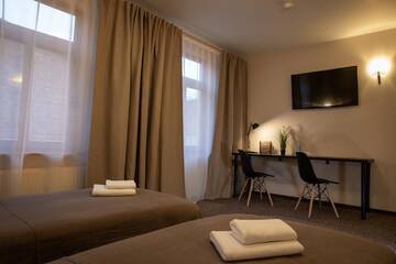 Фото номера Двухместный номер с 2 отдельными кроватями Отель Porins Hotel г. Лиепая 7