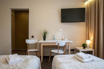 Фото номера Двухместный номер с 2 отдельными кроватями Отель Porins Hotel г. Лиепая 11